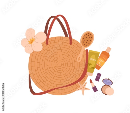 Round straw bag with summer beach essentials. Woven women accessory with cont...