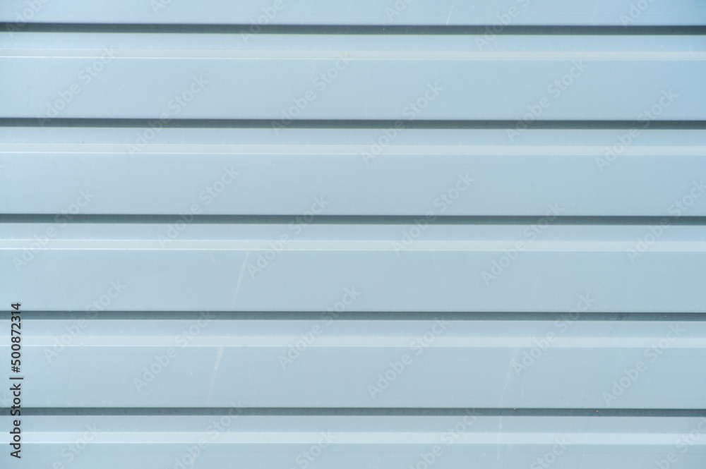 Warehouse wall with metal sheets, close-up Warehouse wall with metal sheets, close-up