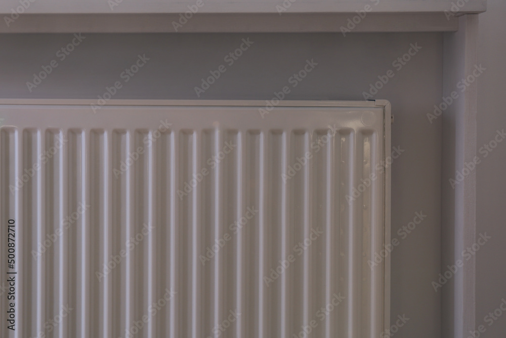 Closeup view of modern panel radiator indoors Closeup view of modern panel radiator indoors