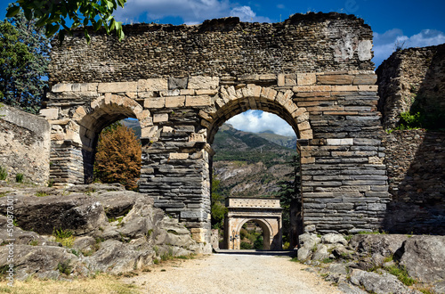 Fototapeta Ruins of ancient roman aqueduct in Susa, Italy