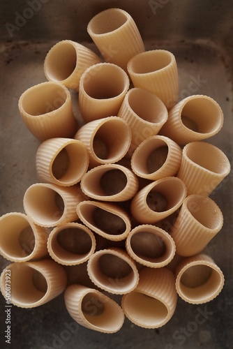 Italian dry pasta in the form of empty corrugated thick tubes © scaffer