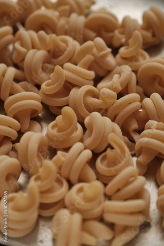italian dry pasta in the form of a spiral cone