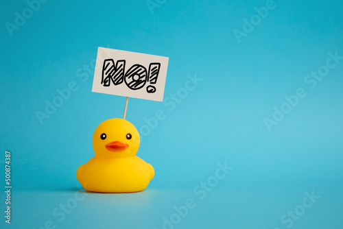 Rubber duck carries a signboard with the word no. Political activism and voting photo
