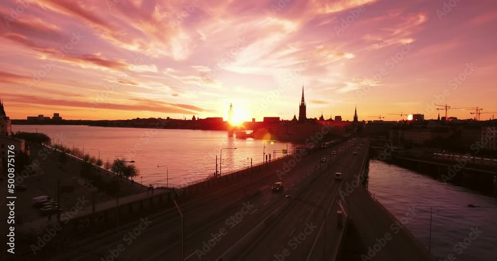 Aerial Beautiful Shot Of Church On City Landscape, Drone Flying Forward Over Cars Moving On Bridge Road - Stockholm, Sweden Aerial Beautiful Shot Of Church On City Landscape, Drone Flying Forward Over Cars Moving On Bridge Road - Stockholm, Sweden