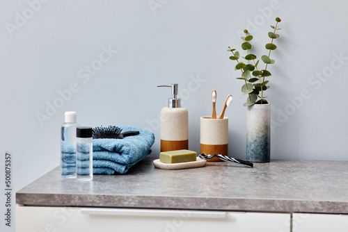 Foto Image of toilet table with toiletries, towel and cosmetic for face care in bathr