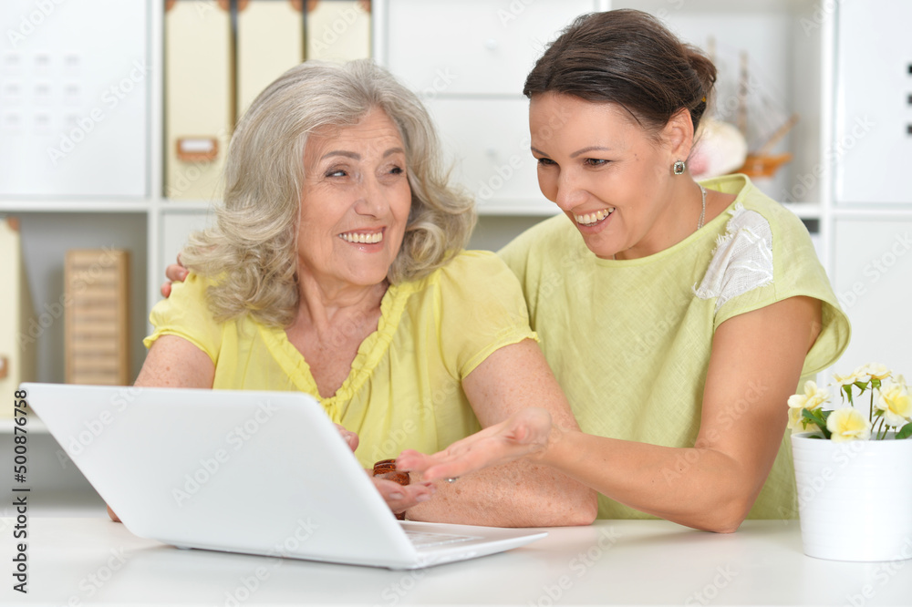 Portrait of beautiful women using laptop at home Portrait of beautiful women using laptop at home