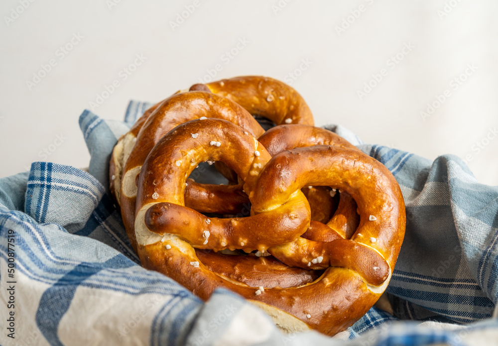 Group of brezels or pretzels in bread basket with napkin Group of brezels or pretzels in bread basket with napkin