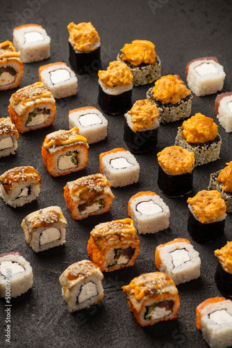 Sushi set pattern on black background