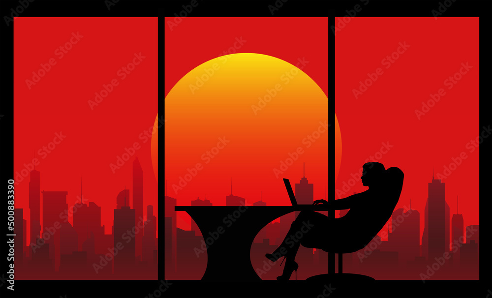 Naklejka premium silhouette of a woman sitting in an armchair at a table in an office with large windows against the backdrop of skyscrapers and the evening sun on a red sky