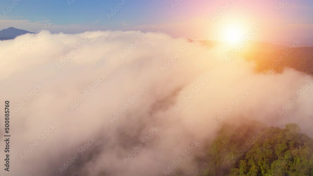 Aerial view from a drone over mountain fog during sunrise. fog in the morning. Flight above clouds. Khao sok National Park, Surat Thani, Thailand. 4K
Aerial view from a drone over mountain fog during sunrise. fog in the morning. Flight above clouds. Khao sok National Park, Surat Thani, Thailand. 4K