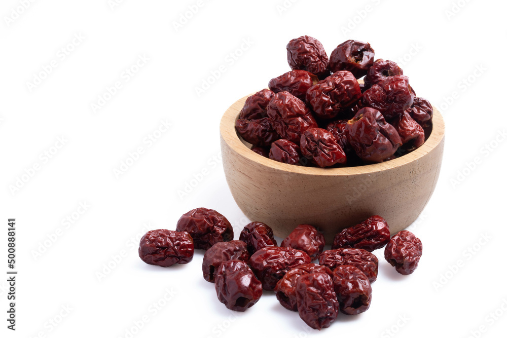 Dried Chinese jujube in a cup on white background. Isolated image. Dried Chinese jujube in a cup on white background. Isolated image.