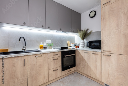 Fototapeta Naklejka Na Ścianę i Meble -  Fitted kitchen in small new apartment,