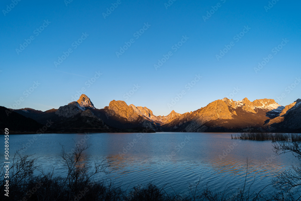 Sunrise over mountains at Riaño reservoir in Spain