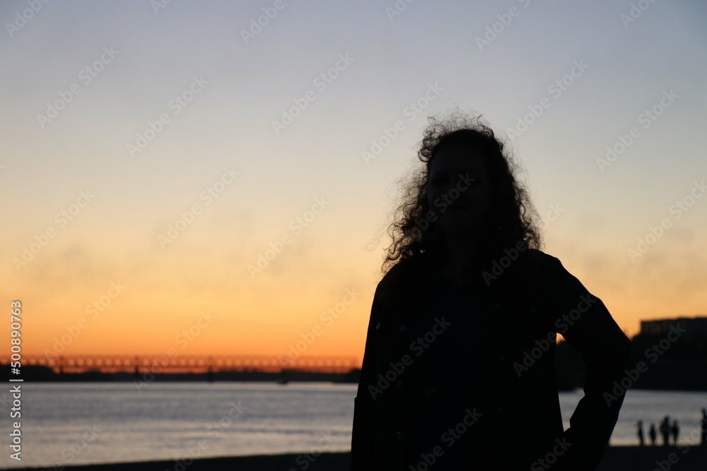 Silhouette in the evening embankment