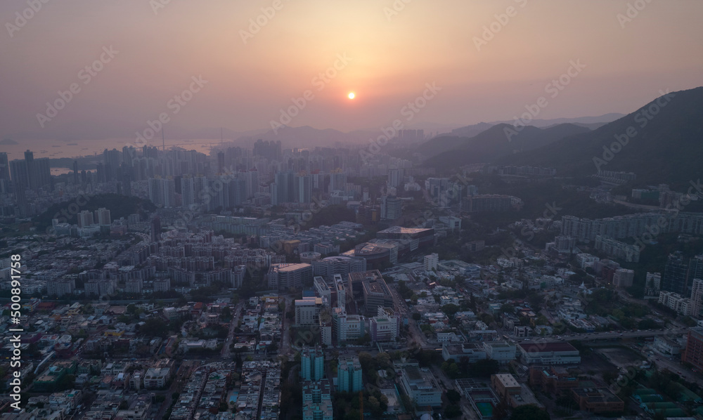 Urban horizontal skyline during he bright of sunset in Hong Kong