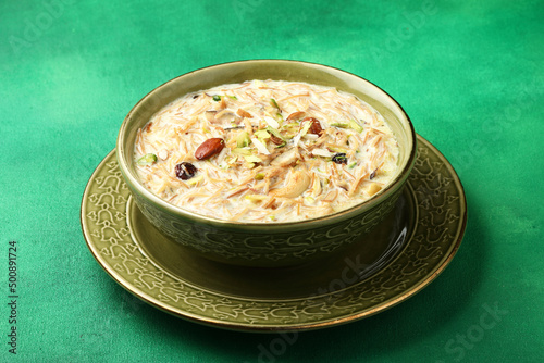 Khir or kheer payasam also known as Sheer Khurma Seviyan consumed especially on Eid or any other festival in india/asia. Served with dry fruits toppings selective focus  photo