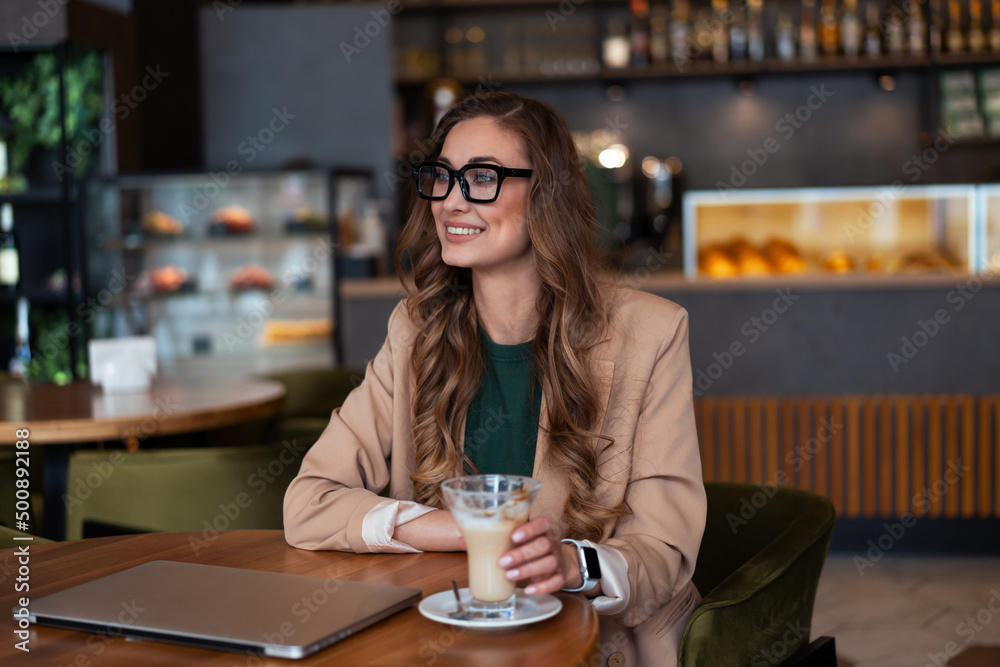 Business Woman Restaurant Owner Use Laptop In Hands Dressed Elegant Pantsuit Sitting Table In Restaurant With Bar Counter Background