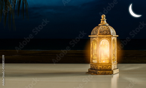 Canvas Print Arabic lanterns decorated with candles lit up at night on a Muslim Ramadan Kareem wooden table