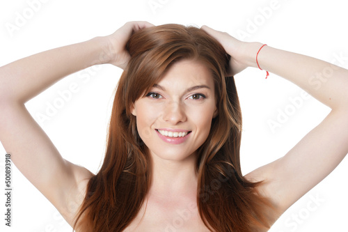 Close-up portrait of beautiful young woman with perfect skin on white background