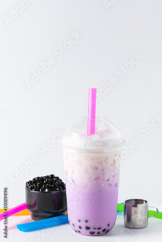 Traditional beverage of asia taiwan,  Ice buble or boba milk tea in plastic cup with straw on white background, summers refreshment.