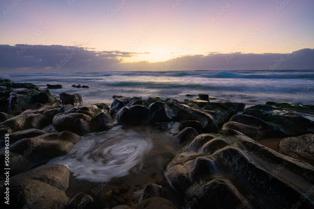 Swirl in a rockpool at Newcastle beach at sunrise, Newcastle, Merewether, NSW, Australia