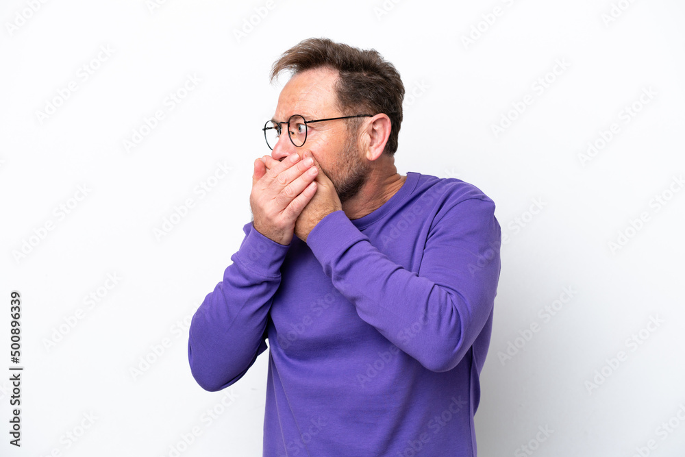 Middle age caucasian man isolated on white background covering mouth and looking to the side Middle age caucasian man isolated on white background covering mouth and looking to the side