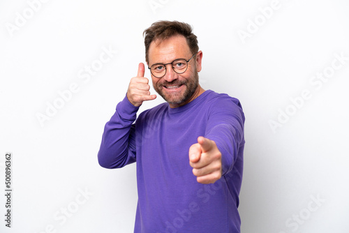 Middle age caucasian man isolated on white background making phone gesture and pointing front