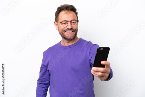 Middle age caucasian man isolated on white background making a selfie © luismolinero