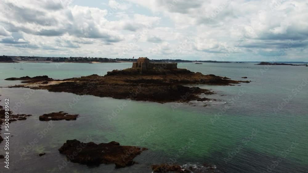 Fort on Petit Be tidal island at Saint-Malo, Brittany in France. Aerial forward Fort on Petit Be tidal island at Saint-Malo, Brittany in France. Aerial forward