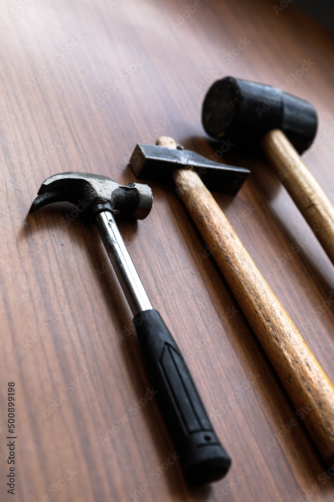  Some tools, a set of hammers with some nails and screws
