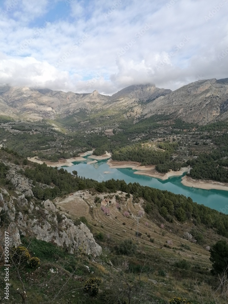The view from El Castell de Guadalest over the Spanish mountains and turquoise lakes