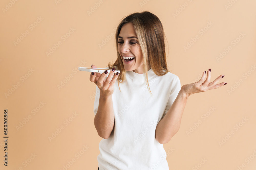 White mid woman gesturing while talking on cellphone