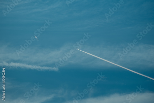 Two planes in the sky releasing chemtrails