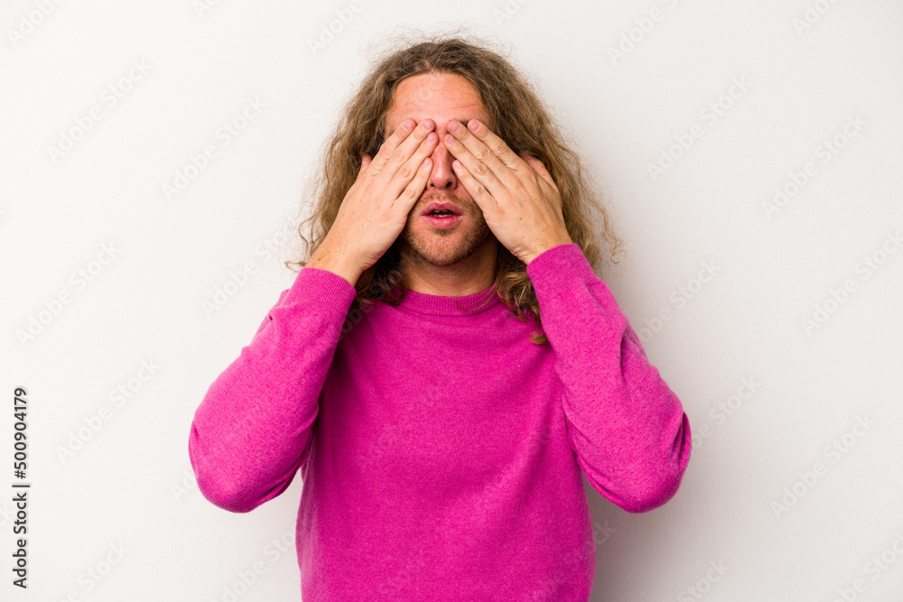 Young caucasian man isolated on white background afraid covering eyes with hands. Young caucasian man isolated on white background afraid covering eyes with hands.