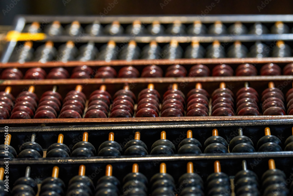 Pile of traditional retro Chinese wooden abacus close-up Pile of traditional retro Chinese wooden abacus close-up