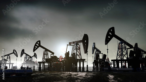 Foto Oil pump, oil industry equipment, drilling derricks silhouette from oil field at sunset
