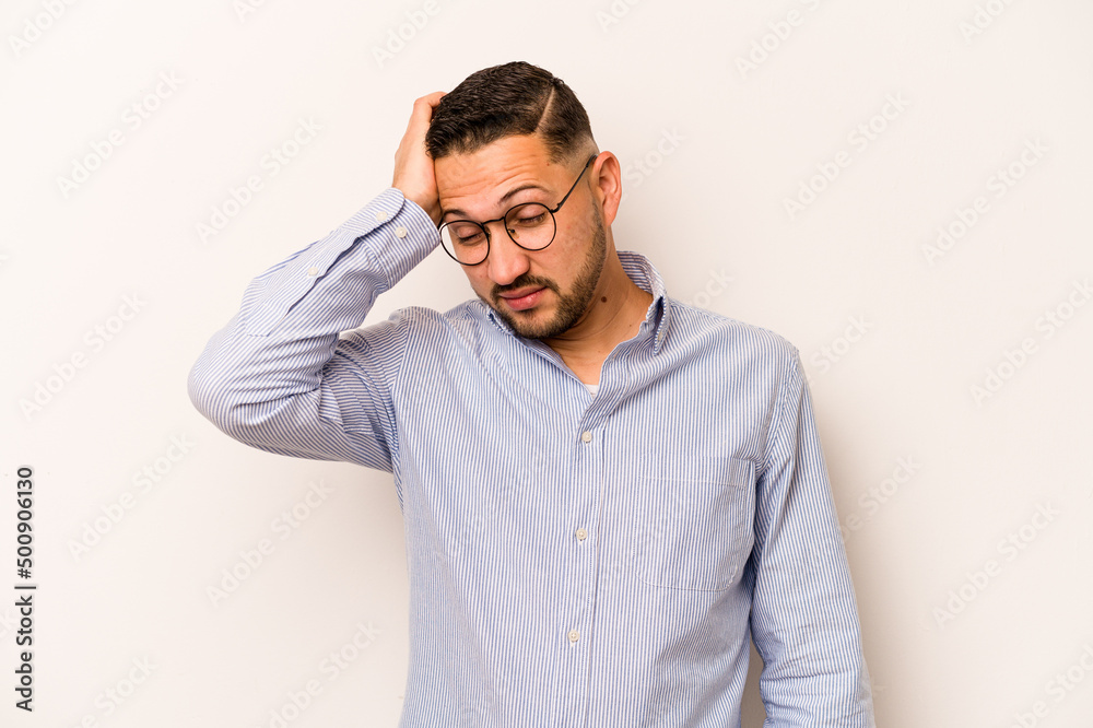 Young hispanic man isolated on white background tired and very sleepy keeping hand on head. Young hispanic man isolated on white background tired and very sleepy keeping hand on head.