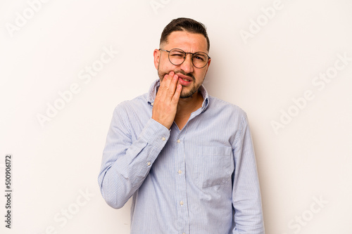Young hispanic man isolated on white background having a strong teeth pain, molar ache.