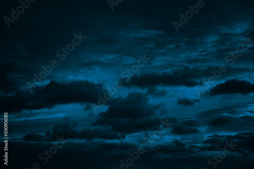 Fototapeta Naklejka Na Ścianę i Meble -  Dark blue green sky with clouds. Dramatic night sky. Moonlight. Toned background with space for design.