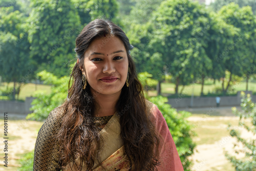 Portrait of happy & confident young Indian woman in saree
Portrait of happy & confident young Indian woman in saree