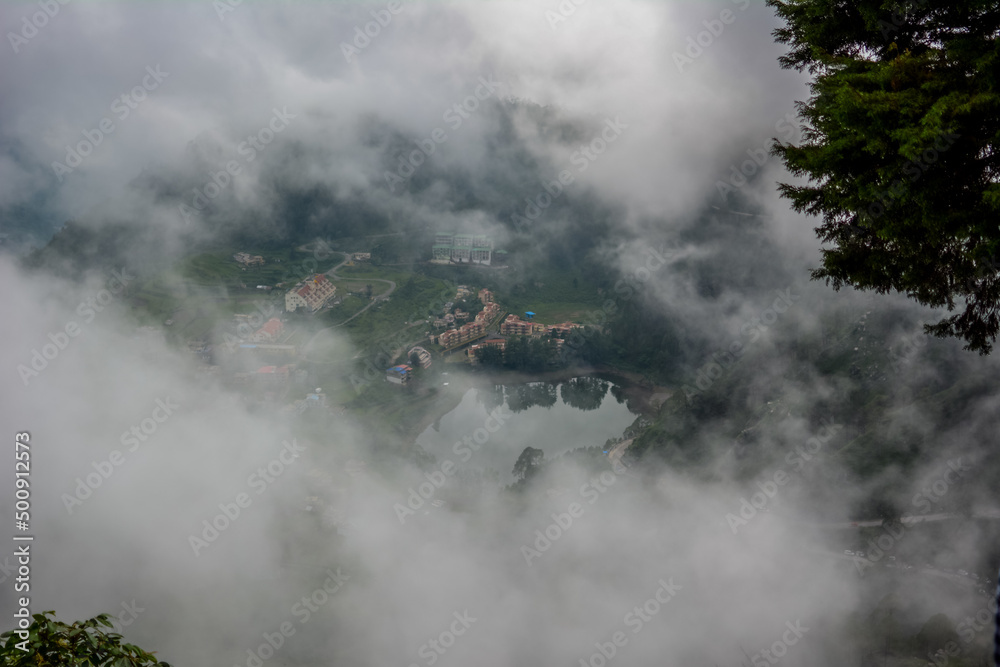 View of misty mountains of Nainitaal in Uttrakhand, India