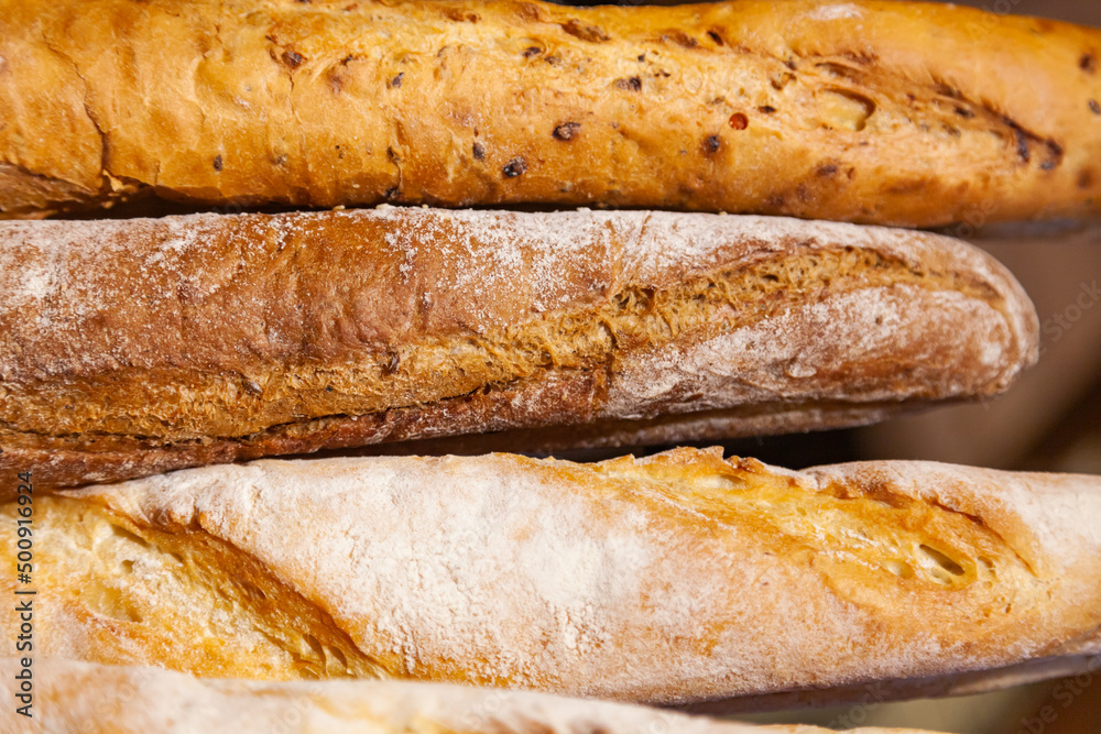 Several French baguette breads, close-up.