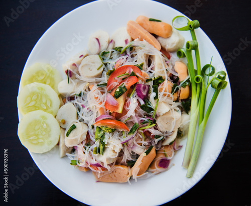 Thai rice noodles with meat and vegetables. photo