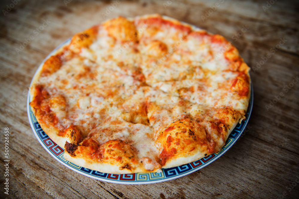 Pizza with cheese and tomatoes. Pizza with cheese and tomatoes.
