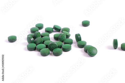 Vitamins antioxidants green. Spirulina Chlorella natural green superfood. dietary supplements. Pills isolated on white background. seaweed medicines. High quality photo