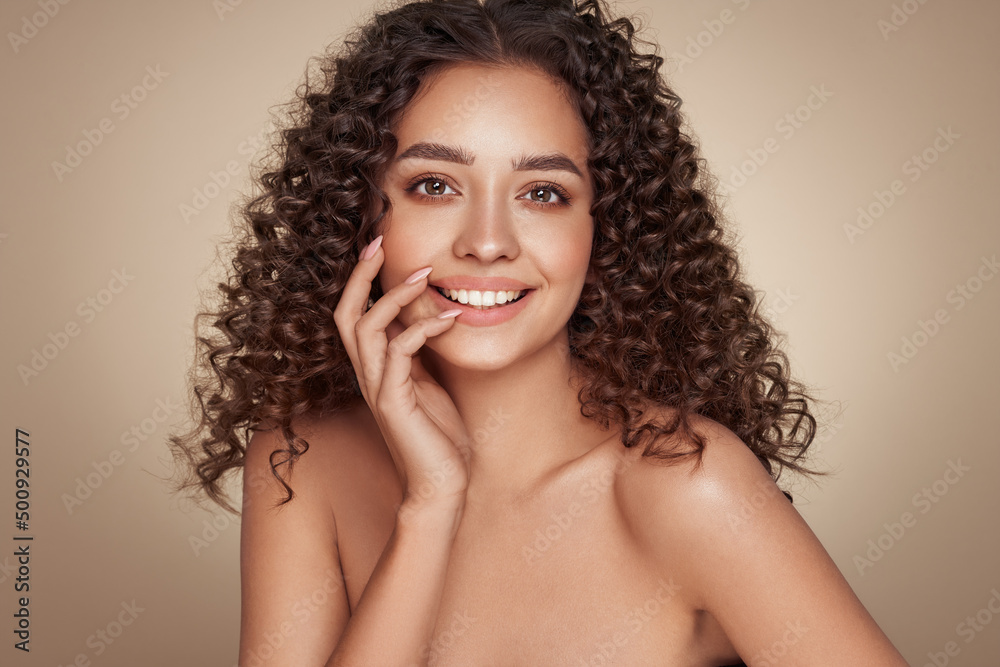 Fashion studio portrait of beautiful smiling woman with afro curls hairstyle. Fashion and beauty Fashion studio portrait of beautiful smiling woman with afro curls hairstyle. Fashion and beauty