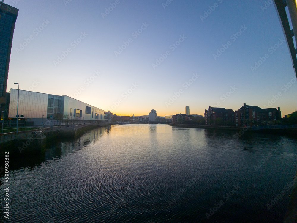 Buildings near Lagan River In Belfast Northern Ireland, Beautiful sunset over city 