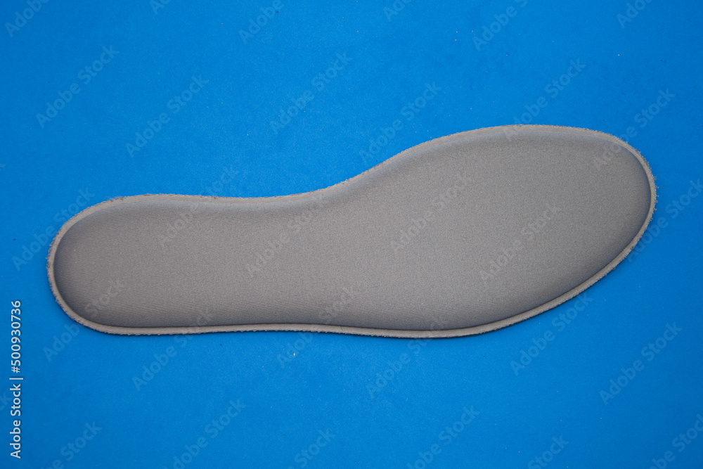 gray Memory Foam Shoe Insoles on blue background gray Memory Foam Shoe Insoles on blue background