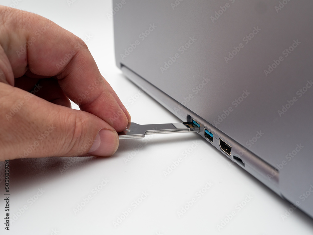 usb flash drive in the form of a key and a laptop.