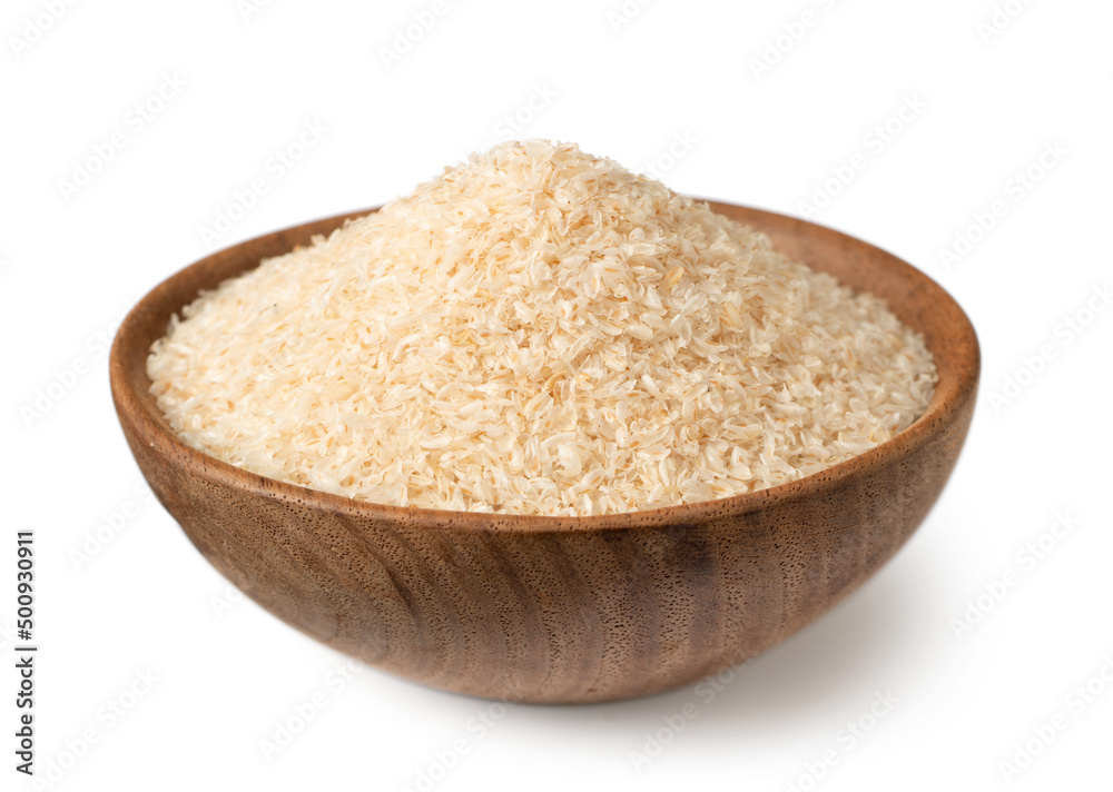 Psyllium husks in the wooden bowl, isolated on white background. Psyllium husks in the wooden bowl, isolated on white background.